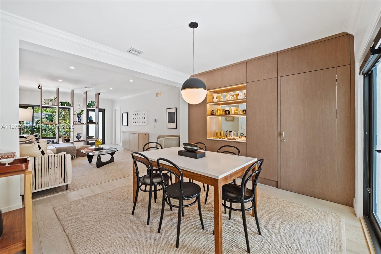 740 Northeast 76th Street Miami, FL 33138 - Photo 10 of 43 a view of a dining room with furniture and window