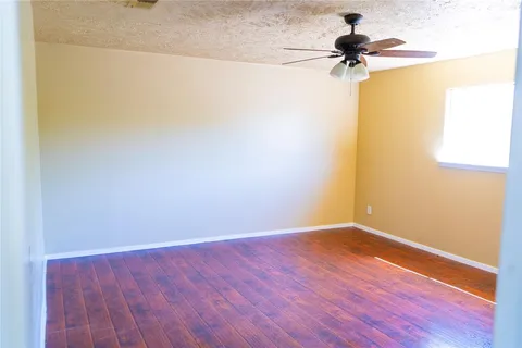 a view of a big room with wooden floor