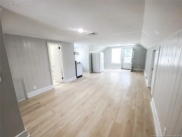 a view of a livingroom with wooden floor