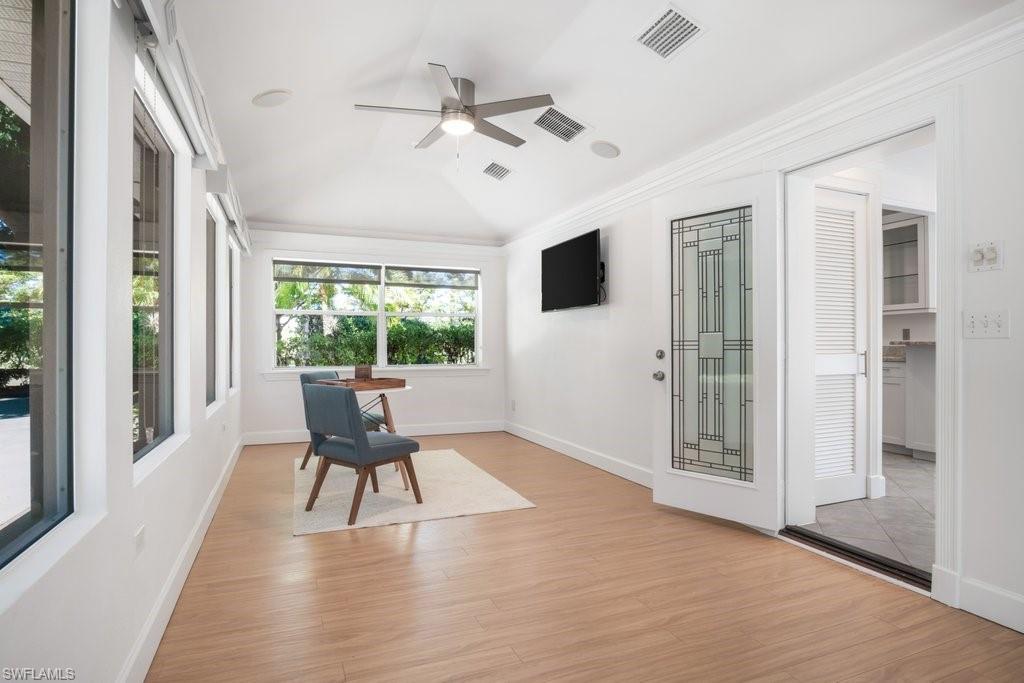 2300 North Road Naples, FL 34104 - Photo 13 of 20 a view of a livingroom with furniture window and wooden floor