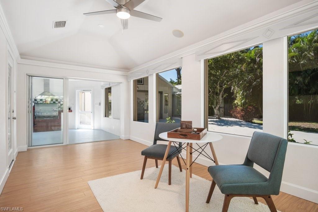 2300 North Road Naples, FL 34104 - Photo 14 of 20 a living room with furniture and a large window