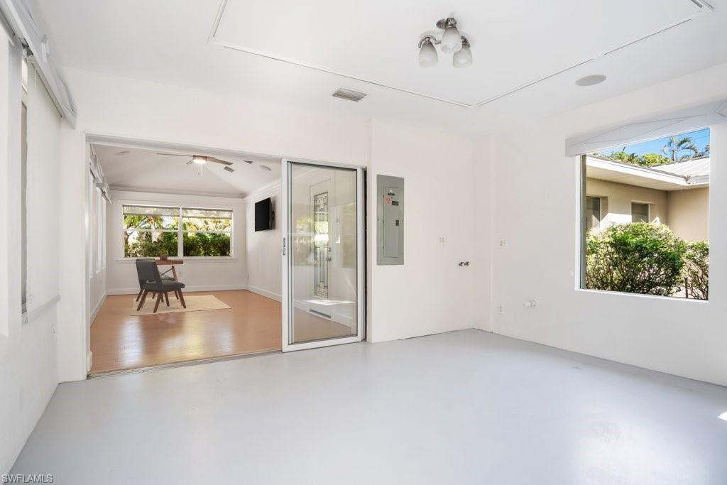 2300 North Road Naples, FL 34104 - Photo 15 of 20 a view of a livingroom with furniture window and wooden floor