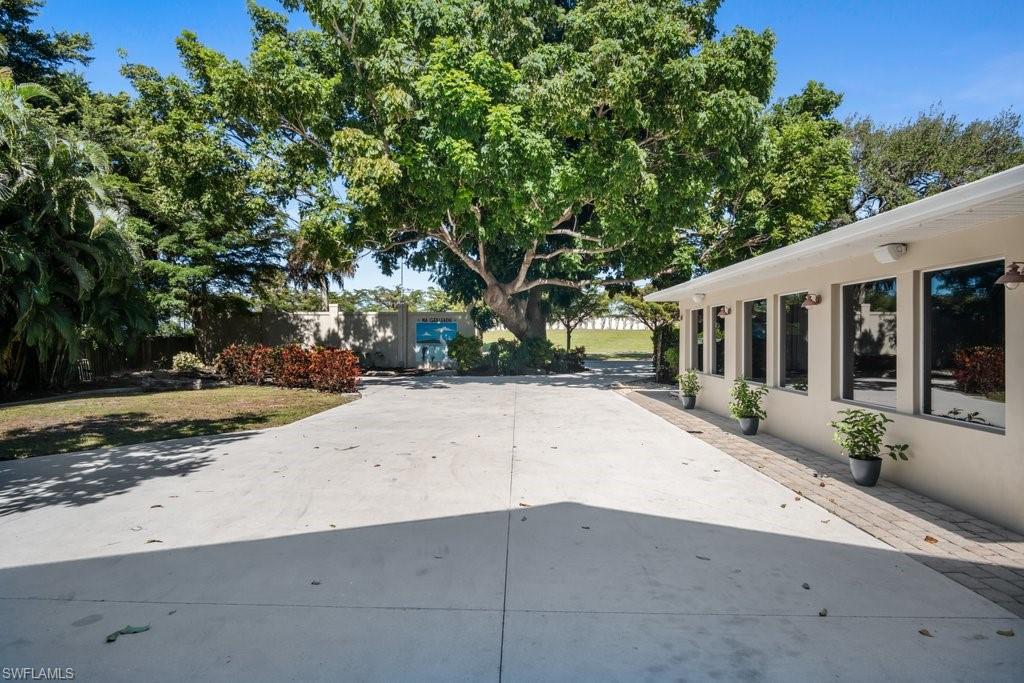 2300 North Road Naples, FL 34104 - Photo 7 of 20 a view of a house with a yard