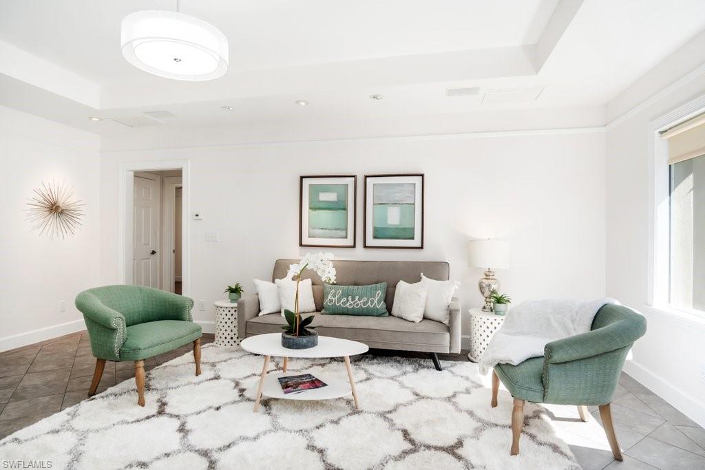 2300 North Road Naples, FL 34104 - Photo 8 of 20 a living room with furniture and a potted plant