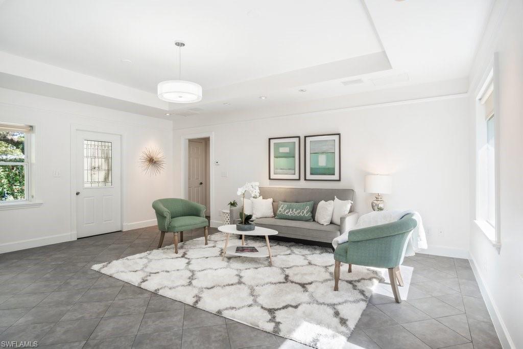 2300 North Road Naples, FL 34104 - Photo 9 of 20 a living room with furniture and a window
