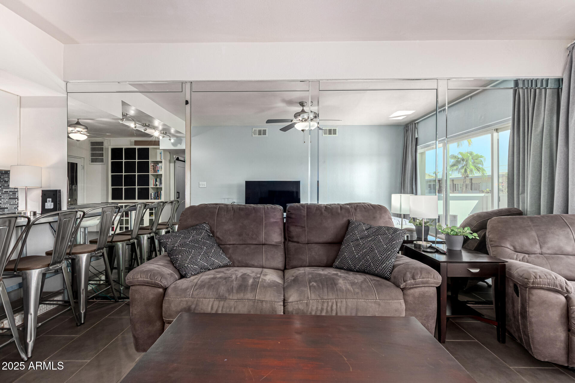 351 East Thomas Road, Unit D505 Phoenix, AZ 85012 - Photo 13 of 28 a living room with furniture and a chandelier