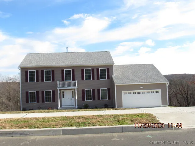 a view of a house with a street