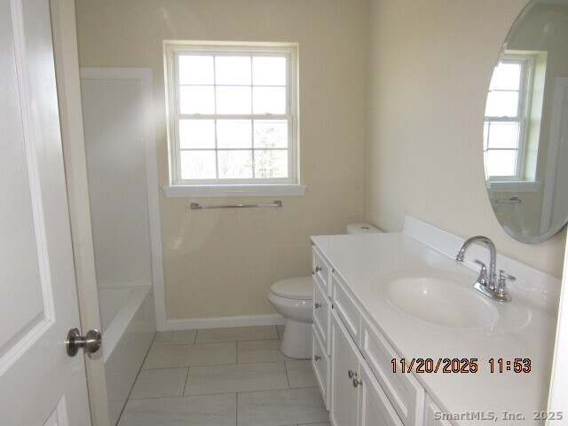 31 Warm Earth Road Naugatuck, CT 06770 - Photo 19 of 36 a bathroom with a sink a toilet and window