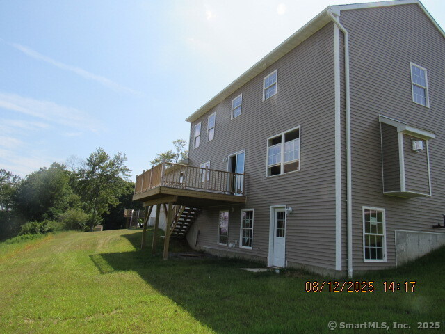 31 Warm Earth Road Naugatuck, CT 06770 - Photo 7 of 36 a backyard of a house with table and chairs