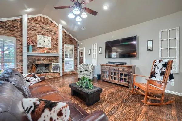 a living room with furniture fireplace and a fireplace