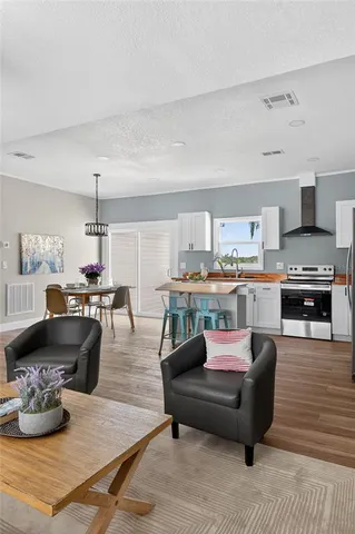 a view of a dining room kitchen with a table and chairs