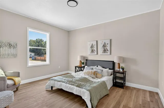 a bedroom with a bed and furniture