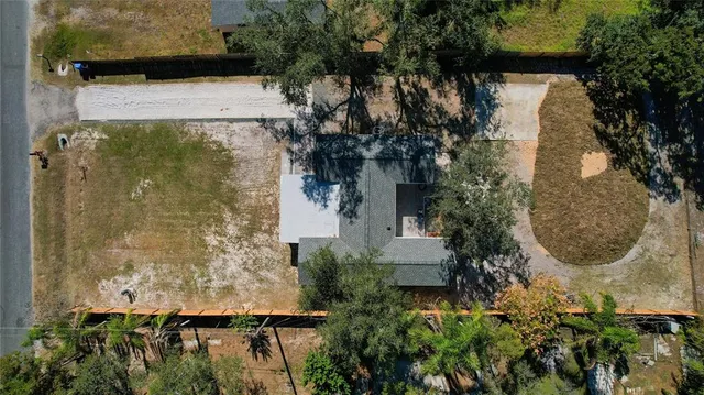an aerial view of a house with a garden