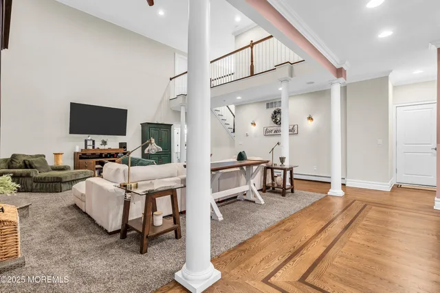 a dining room with furniture and window