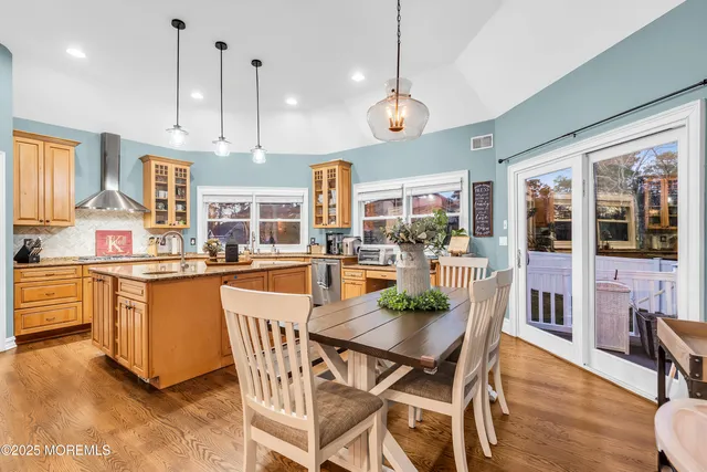 a kitchen with a sink window and cabinets