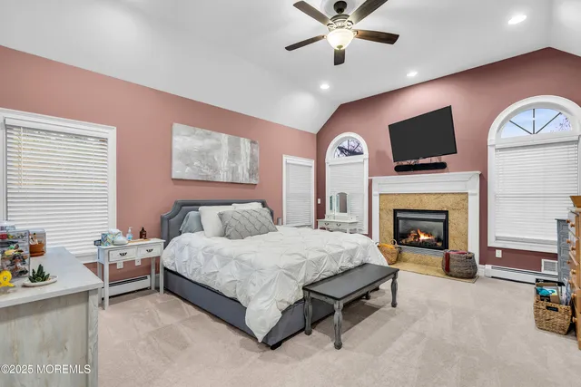 a bedroom with furniture and a rug