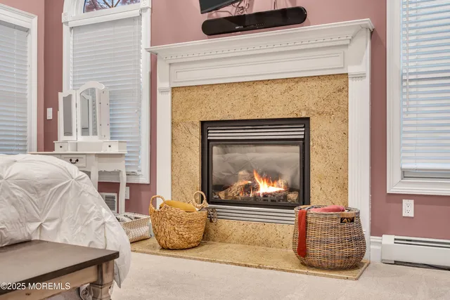 a bathroom with a granite countertop toilet and a sink
