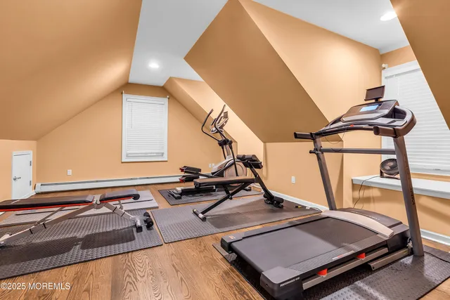 a front view of house with backyard and green space