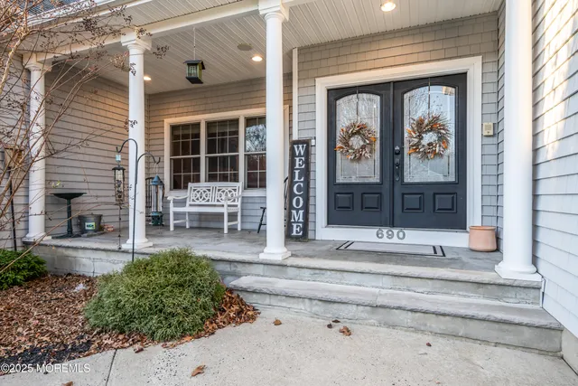 a front view of a house with a outdoor seating space