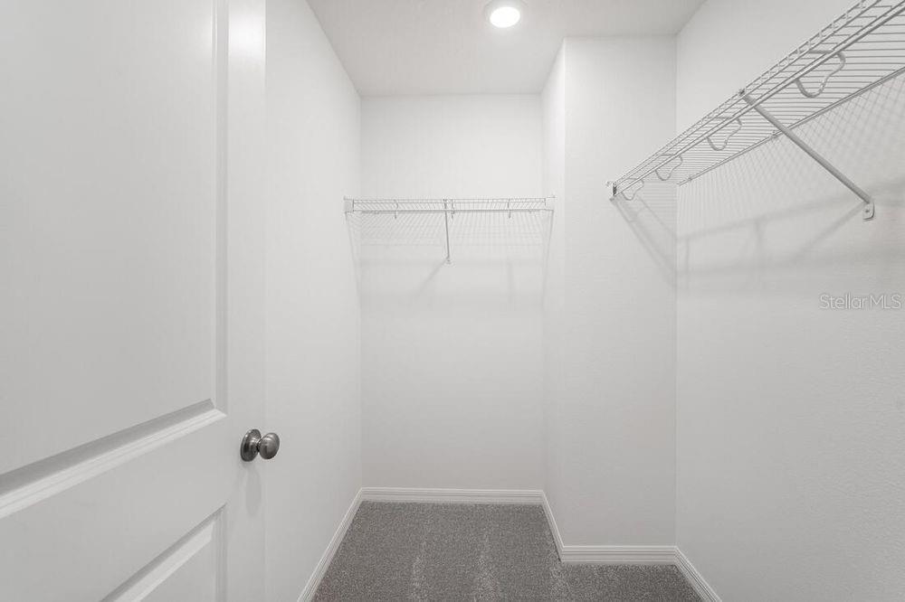 13812 Shellmore Avenue Palmetto, FL 34221 - Photo 14 of 30 a view of small space with racks on the wall