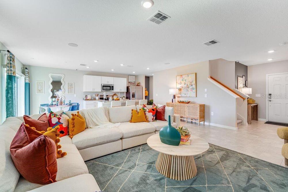 13812 Shellmore Avenue Palmetto, FL 34221 - Photo 26 of 30 a living room with furniture and a wooden floor