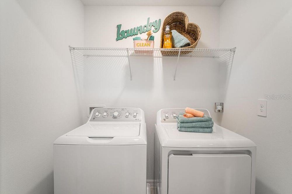 13812 Shellmore Avenue Palmetto, FL 34221 - Photo 6 of 30 a utility room with dryer and washer