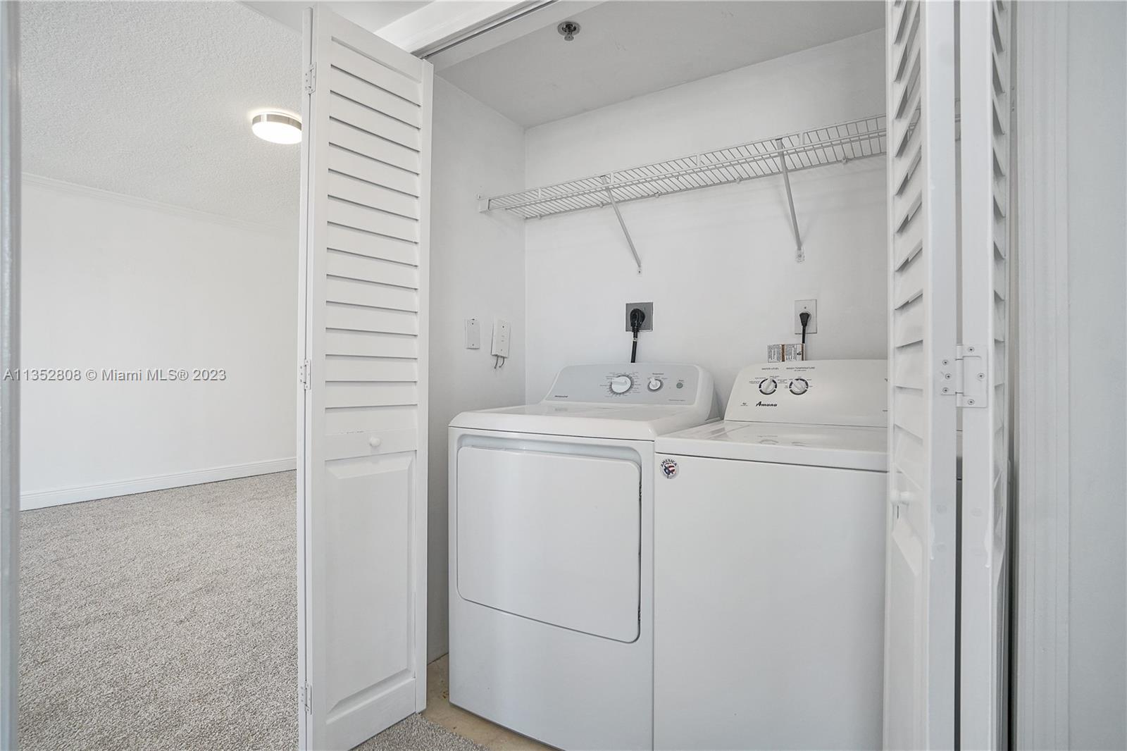 2665 Southwest 37th Avenue, Unit 914 Miami, FL 33133 - Photo 19 of 30 a utility room with dryer and washer