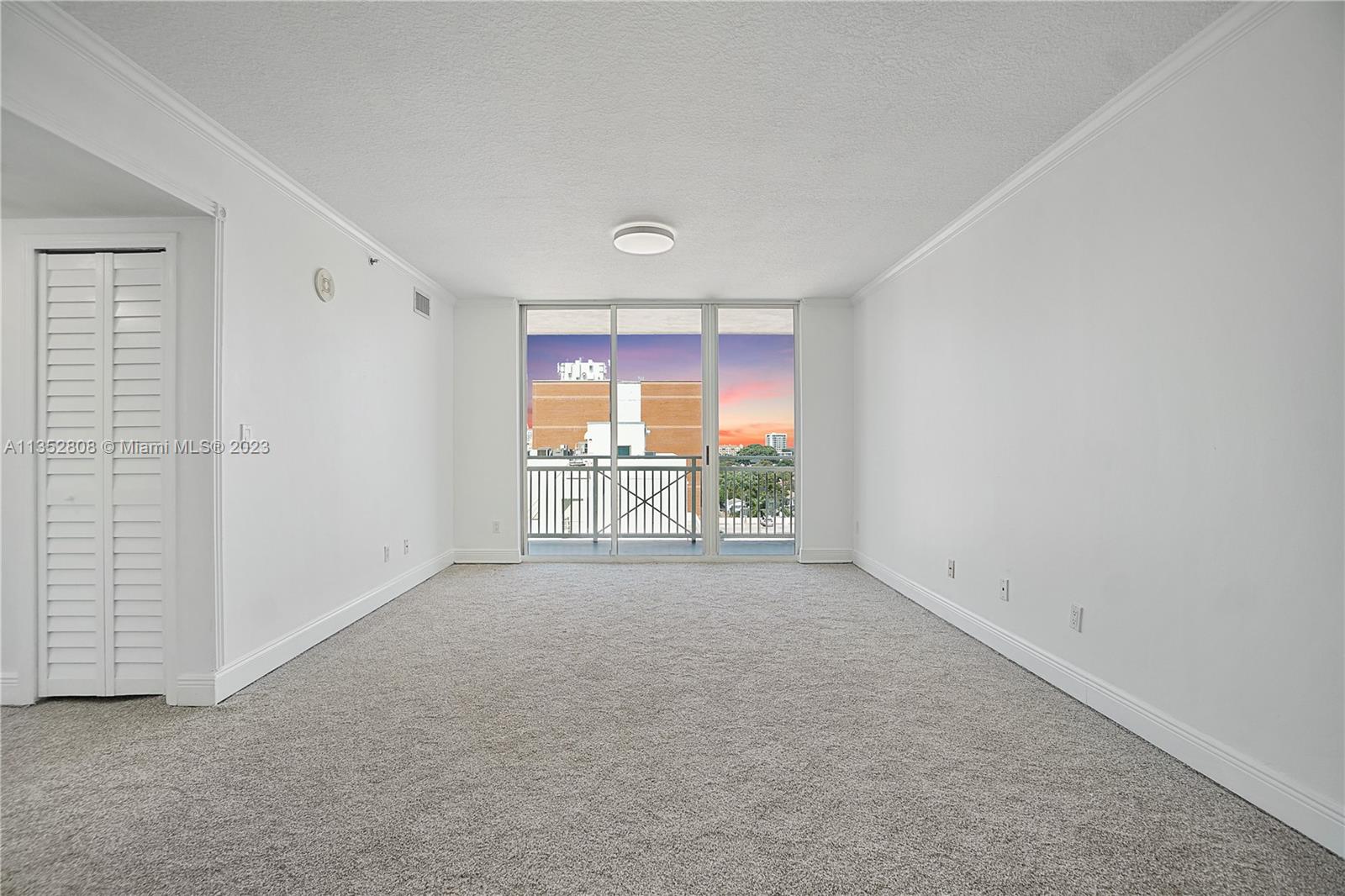 2665 Southwest 37th Avenue, Unit 914 Miami, FL 33133 - Photo 9 of 30 an empty room with windows