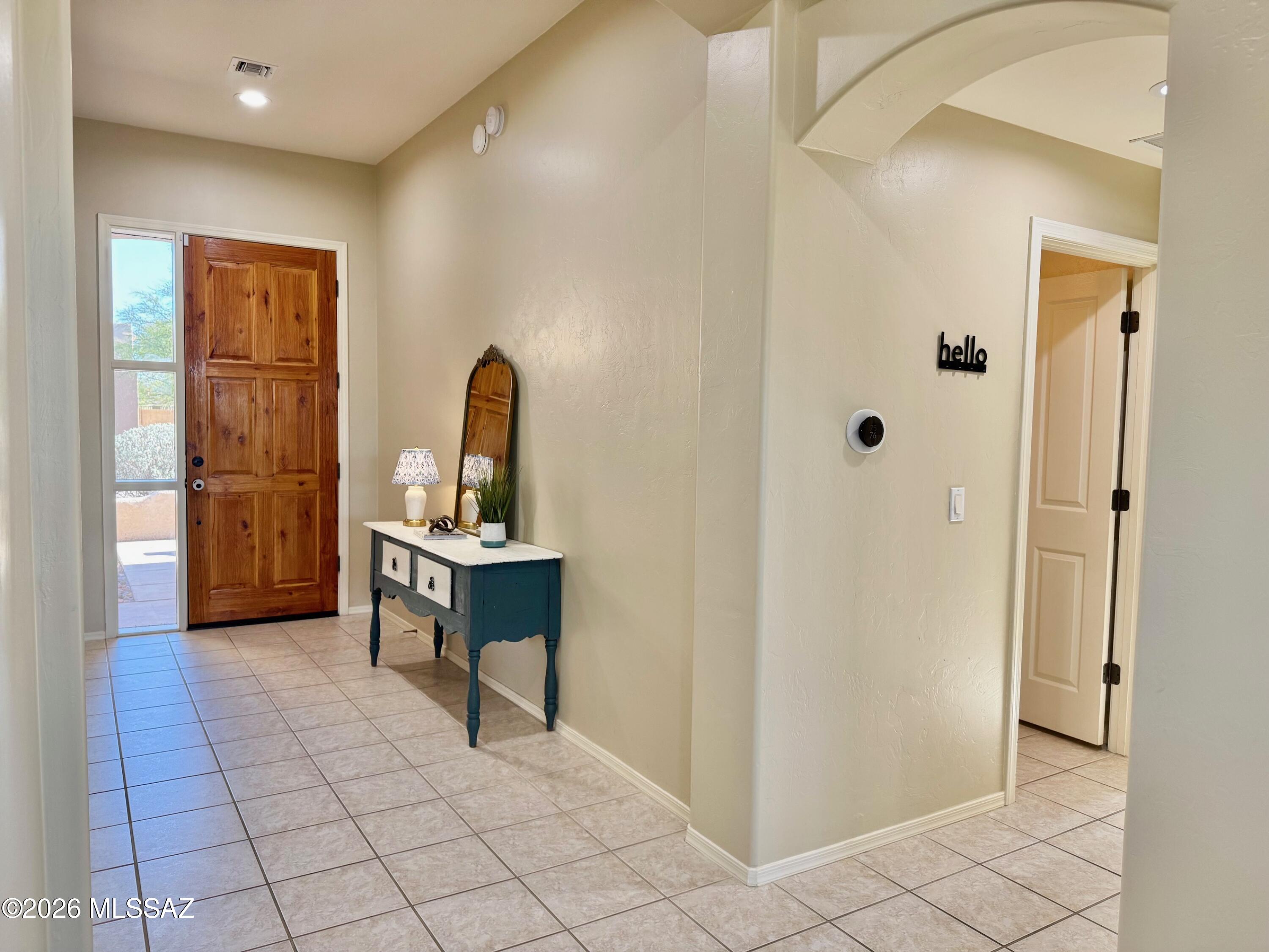 10835 South Heart Break Ridge Place Vail, AZ 85641 - Photo 9 of 49 a view of a hallway with front door