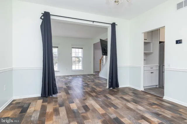a view of entryway with wooden floor