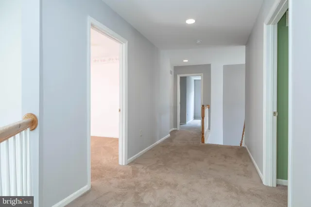 a view of a livingroom and a hallway