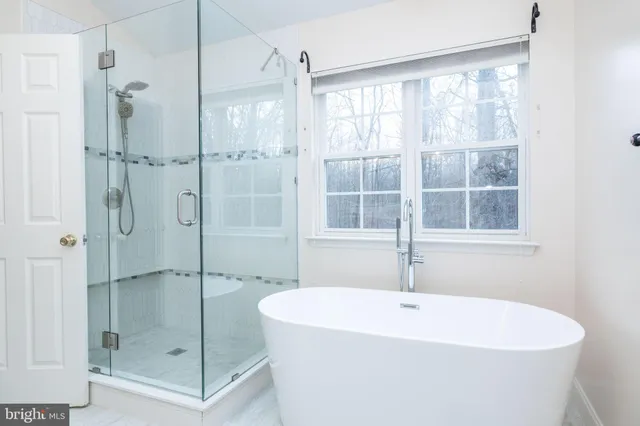 a bathroom with 2 sink and a mirror