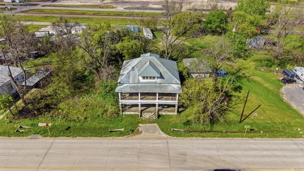 an aerial view of houses with outdoor space