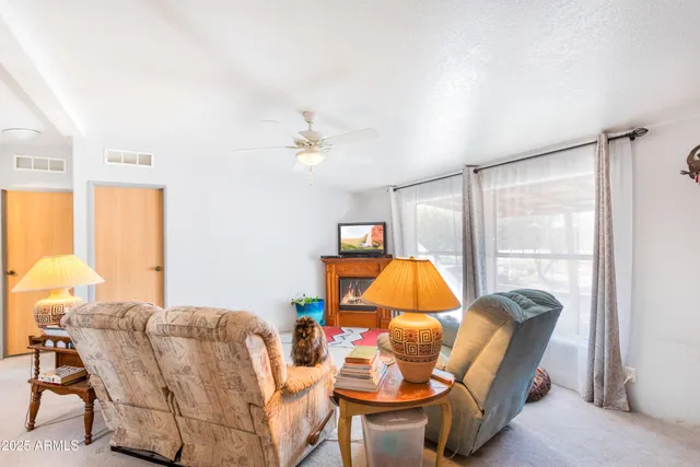 a bed room with a bed and a chandelier