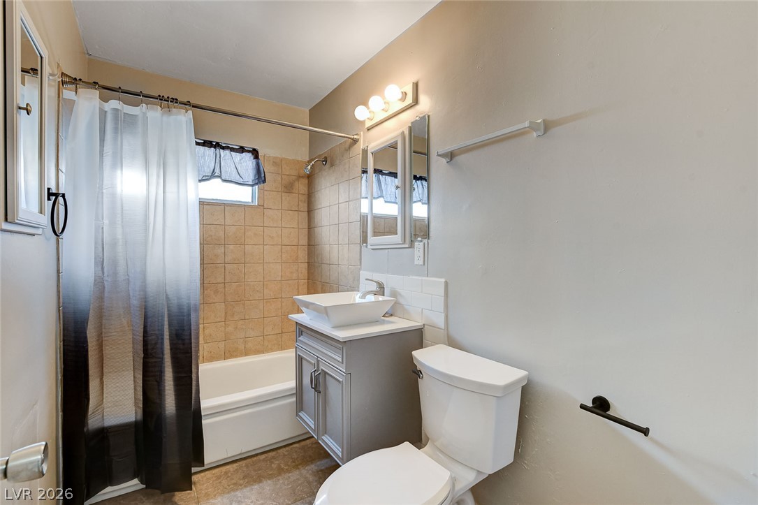 214 West Victory Road Henderson, NV 89015 - Photo 13 of 33 A well-appointed bathroom features a contemporary vanity and a spacious shower.