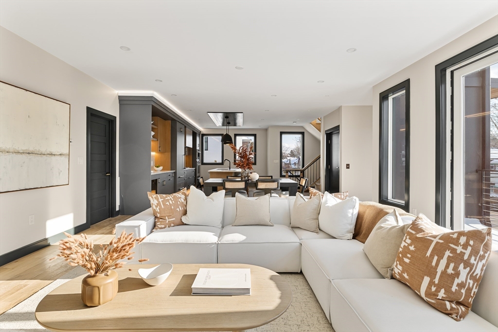 267 Tappan Street, Unit 1 Brookline, MA 02445 - Photo 11 of 23 a living room with furniture and a large window