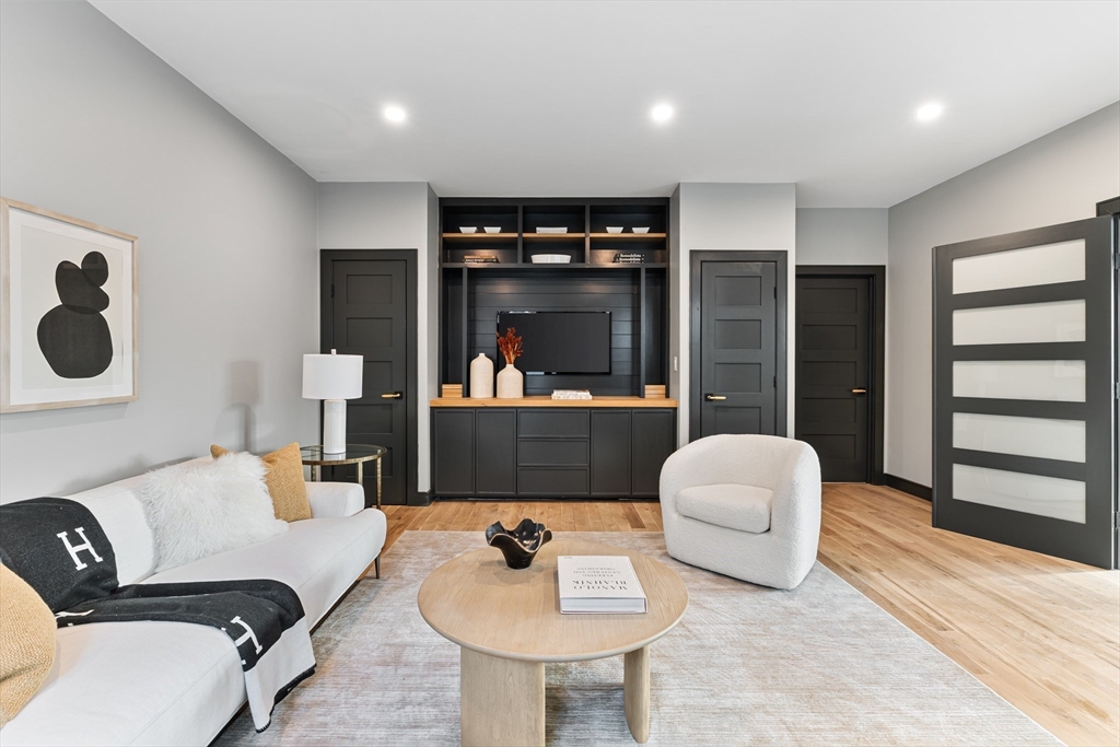 267 Tappan Street, Unit 1 Brookline, MA 02445 - Photo 13 of 23 a living room with furniture and a flat screen tv