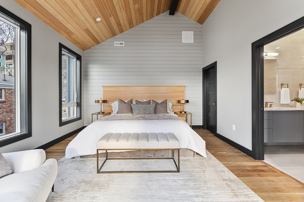 267 Tappan Street, Unit 1 Brookline, MA 02445 - Photo 14 of 23 a spacious bedroom with a bed and large windows