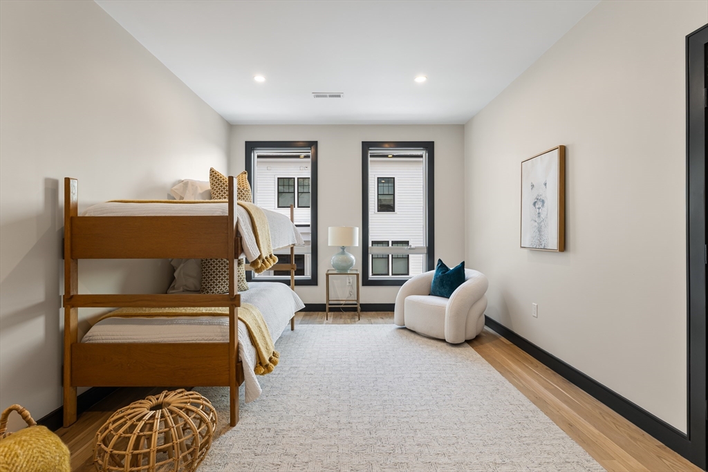 267 Tappan Street, Unit 1 Brookline, MA 02445 - Photo 17 of 23 a bedroom with furniture and a couch