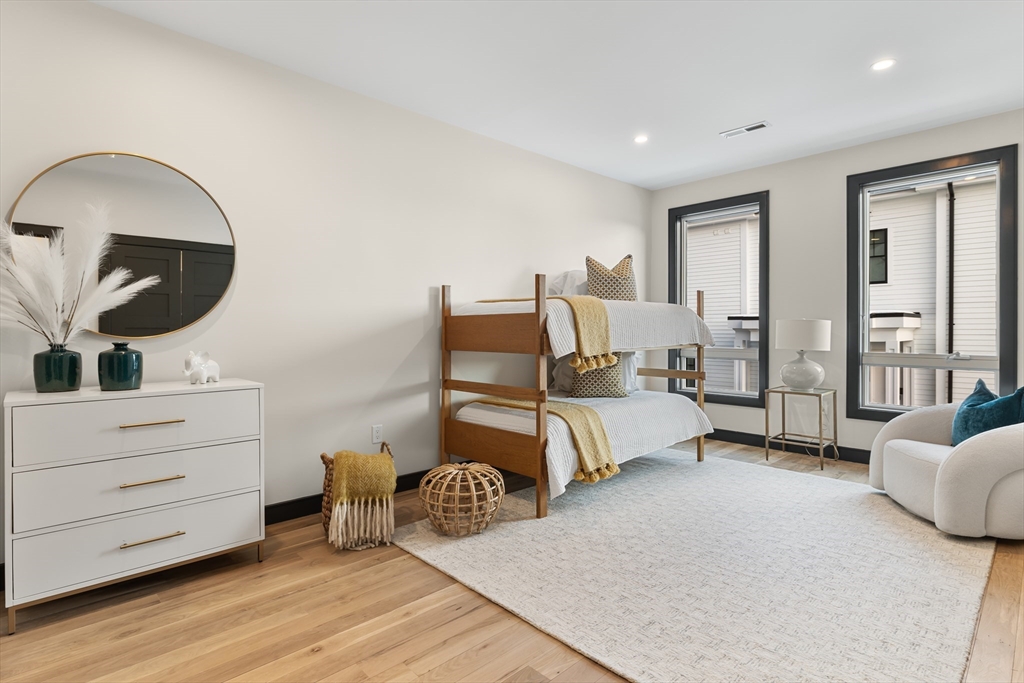 267 Tappan Street, Unit 1 Brookline, MA 02445 - Photo 18 of 23 a bed room with bed and window