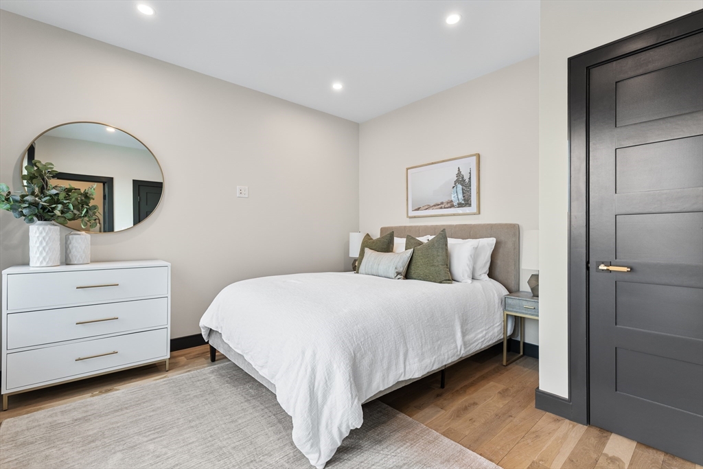 267 Tappan Street, Unit 1 Brookline, MA 02445 - Photo 20 of 23 a bedroom with a bed and a dresser