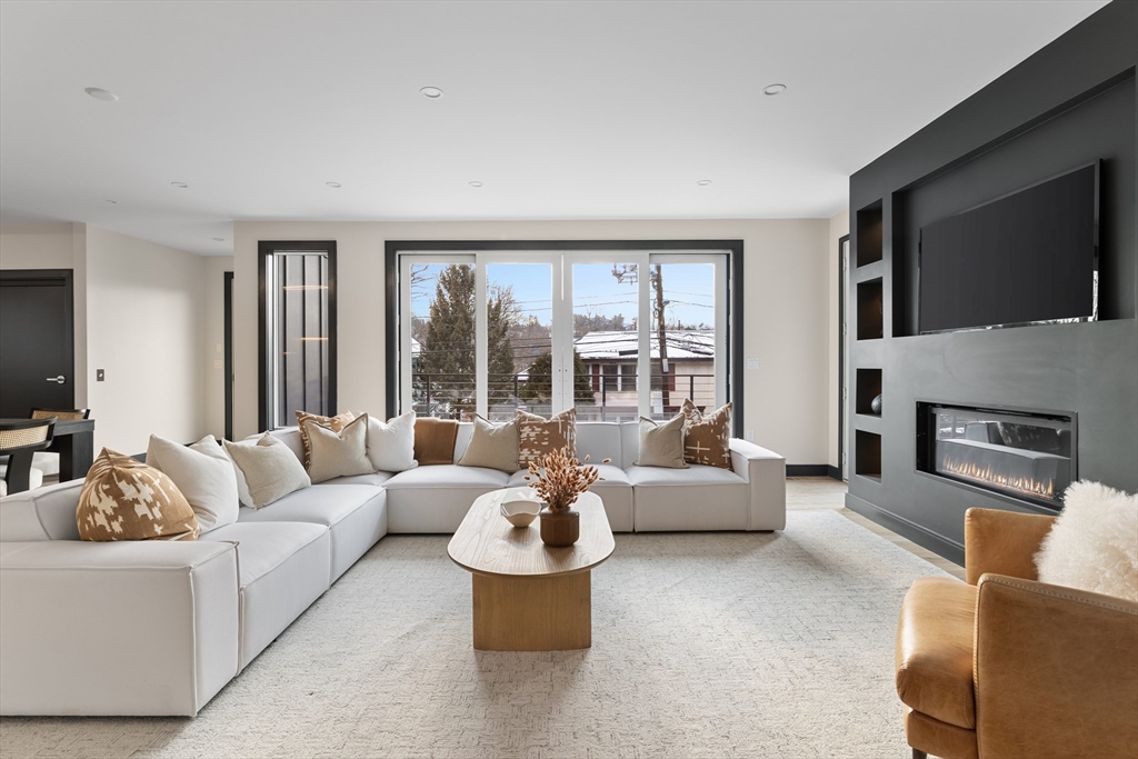 267 Tappan Street, Unit 1 Brookline, MA 02445 - Photo 7 of 23 a living room with furniture and a large window