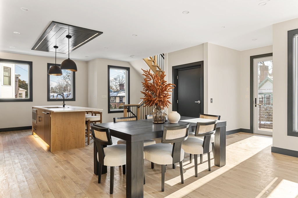 267 Tappan Street, Unit 1 Brookline, MA 02445 - Photo 9 of 23 a view of a dining room with furniture and wooden floor
