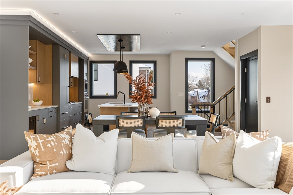 267 Tappan Street, Unit 1 Brookline, MA 02445 - Photo 10 of 23 a living room with fireplace furniture and a large window