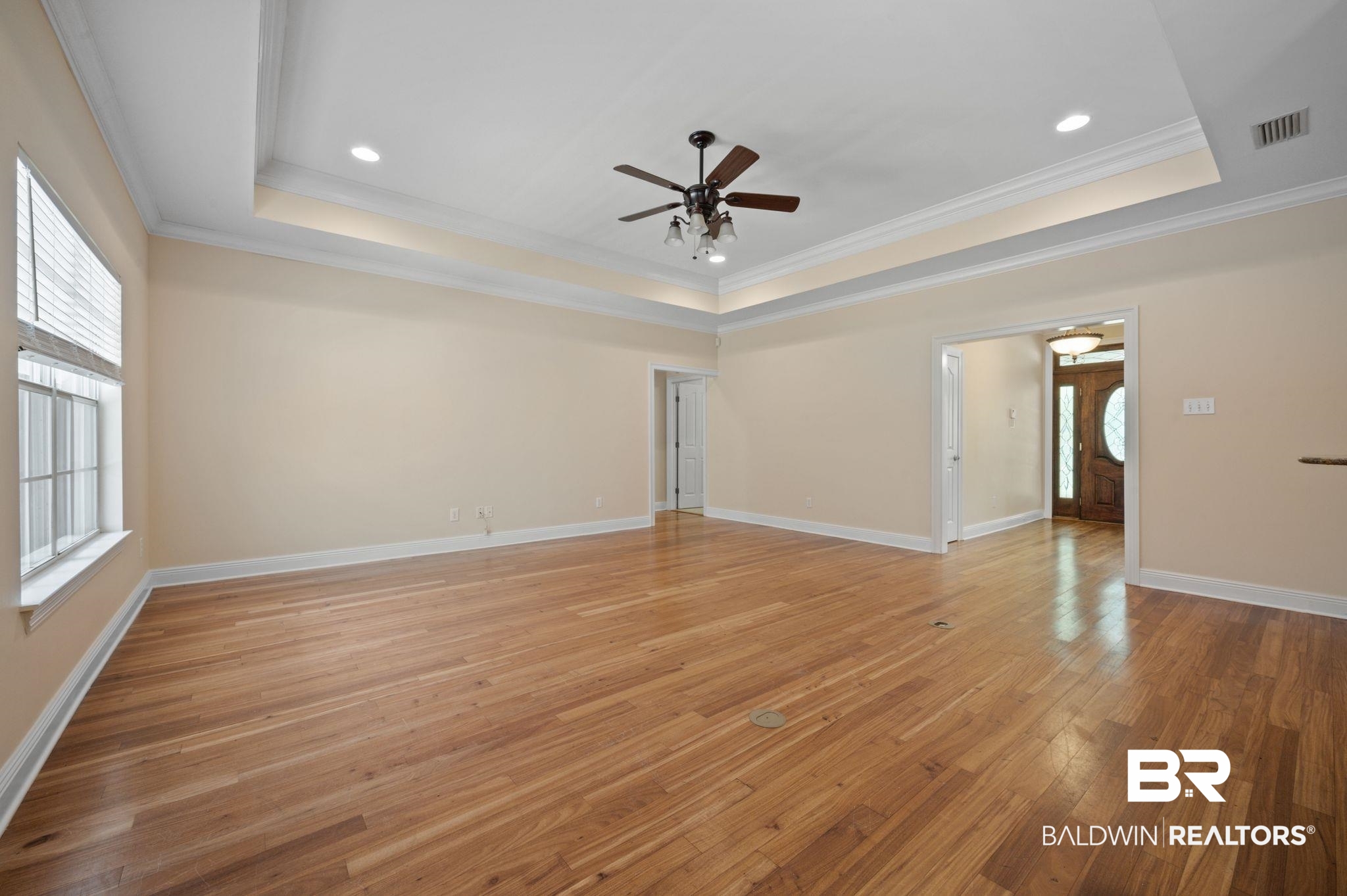 2041 Ridgeline Drive Mobile, AL 36695 - Photo 27 of 43 Spare room with light hardwood / wood-style floors, ceiling fan, crown molding, and a tray ceiling