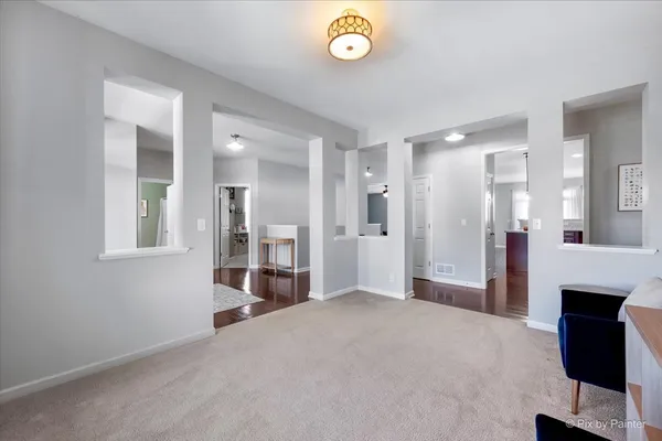 a bedroom with a bed gym equipment and a desk