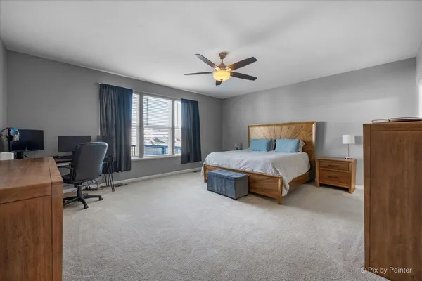 a bedroom with a bed furniture and a window