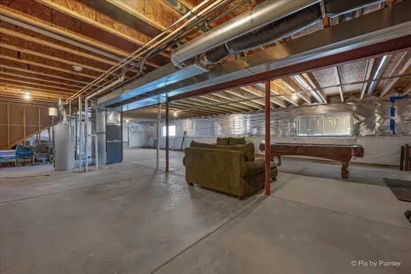 a view of a gym with wooden floor
