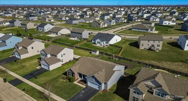 an aerial view of a balcony with chairs