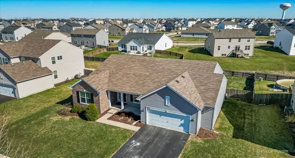 a view of a balcony with wooden floor and outdoor seating